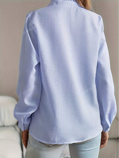 Chic button-up blouse for women, featuring a soft pleated ruffle hem